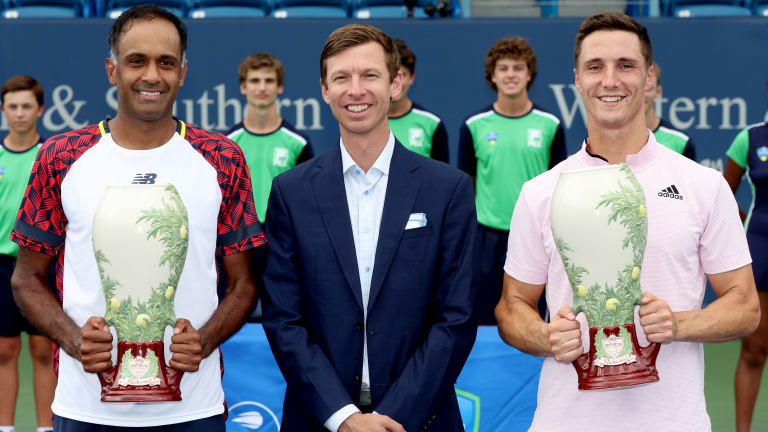 Eric Butorac (middle) fittingly present at the doubles trophy ceremony at the 2022 Western & Southern Open in Cincinnati.