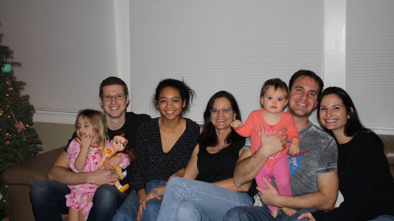 Terry Holladay and family, from left to right: Romyn, Tasha's first child; Terry's son, Louis; Terry's daughter, Maggie; Terry; Michael Tracy, Tasha's husband (holding River, Tasha and Michael’s second daughter); and Tasha.