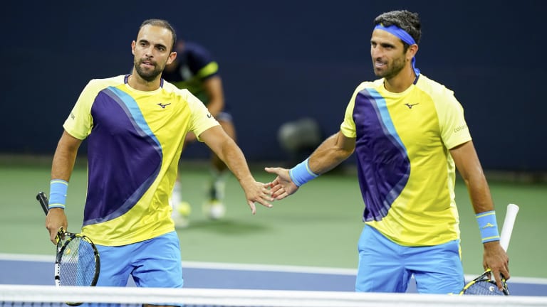 In their famous matching outfits, retiring Juan Sebastian Cabal (left) and Robert Farah waved farewell at the US Open.
