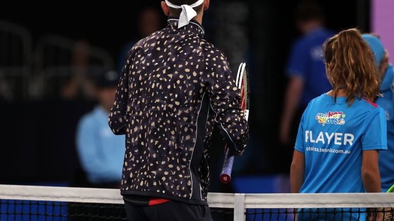 Dimitrov makes a 
tracksuit statement
in Melbourne