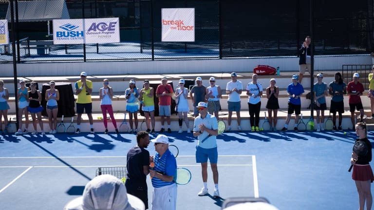 Gael Monfils walks onto center court at the Omni Rancho Las Palmas tennis facility.