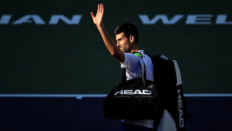 Djokovic waves goodbye to fans after his third-round exit at Indian Wells in 2019. Five years later, the five-time champ will make his return to the desert.