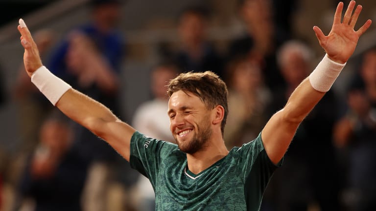 Casper Ruud celebrates match point against Marin Cilic during the Men's Singles Semi Final match of The 2022 French Open at Roland Garros