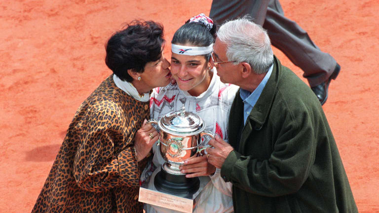 The former No. 1 receives a kiss from her parents after winning the 1994 French Open