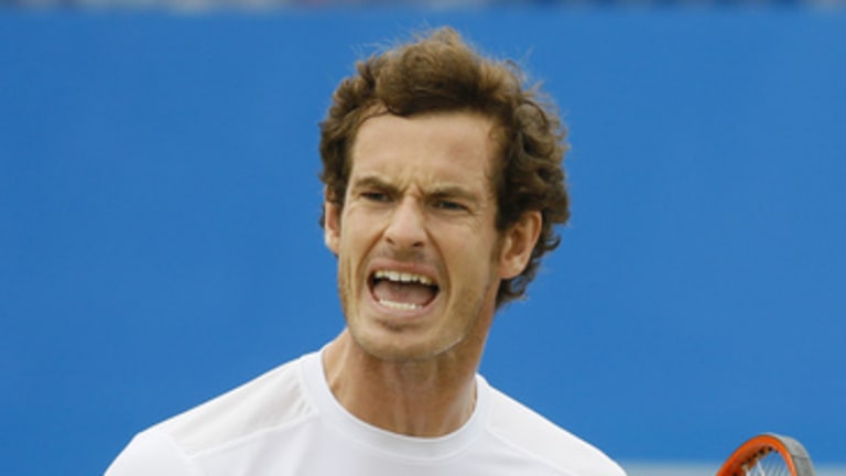Andy Murray of Britain shouts after he plays a return to Viktor Troicki of Serbia during their semifinal tennis match at the Aegon Championships in London, Saturday, June 20, 2015. (AP Photo/Kirsty Wigglesworth)