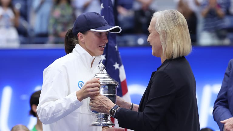 Navratilova presented Swiatek (left) with the 2022 US Open trophy after the Pole's third Grand Slam victory.