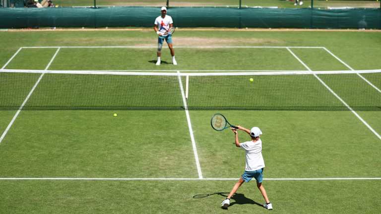 Djokovic's oldest son Stefan joined the seven-time champion for a quick warmup and hit at Aorangi Park.