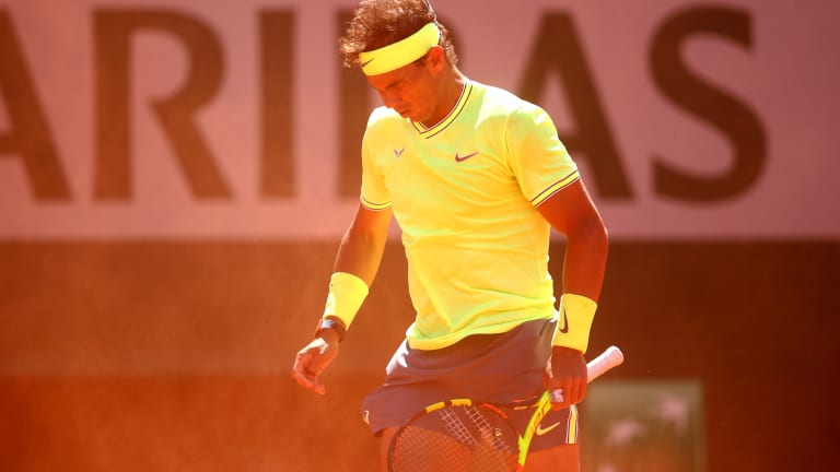 A sturdy and stoic Rafael Nadal survived the wind and Roger Federer