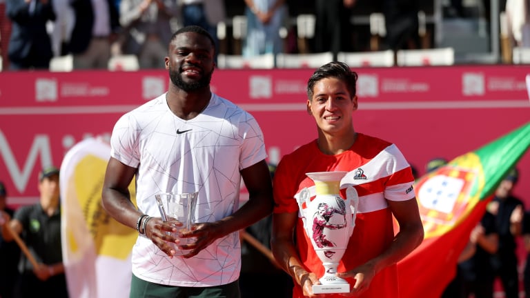 Baez was inspired by the slogan on one of Tiafoe's (left) bracelets: "Why not me?"