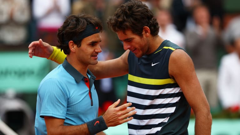 Federer won the last two sets to escape Argentine rival Juan Martin del Potro in a semifinal epic.