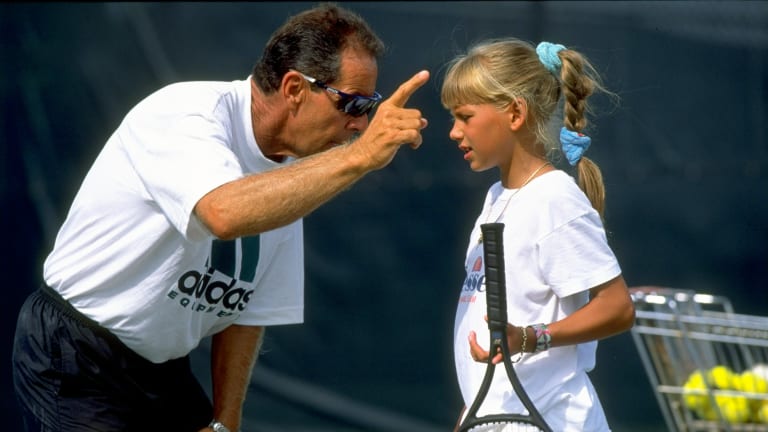 Nick Bollettieri gives pointers to a young Anna Kournikova during one of their session at his academy.
