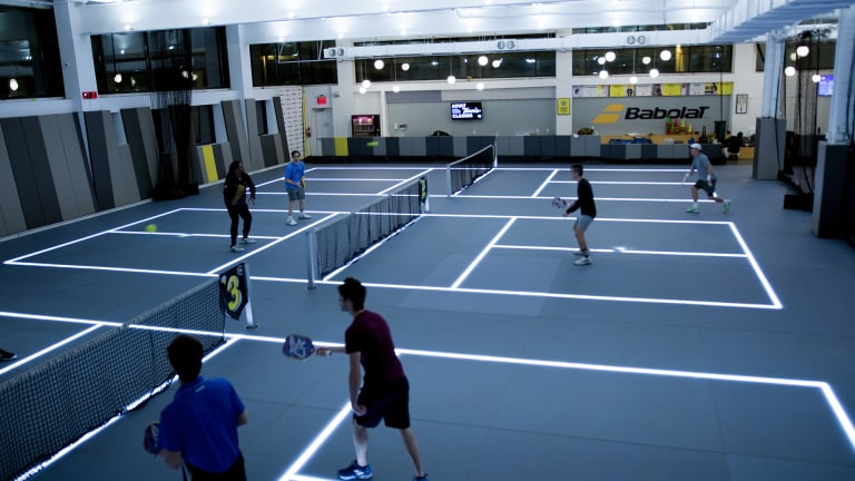 Pickleball courts (pictured here) can seamlessly transform into tennis courts thanks to LED-illuminated lines at Court 16's Long Island City location.