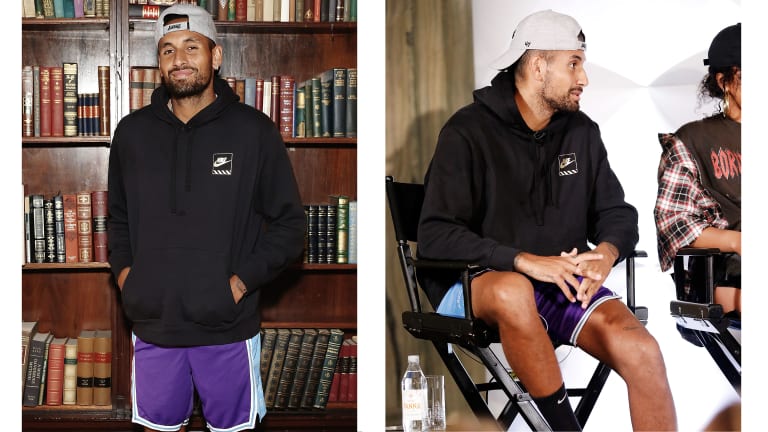 Nick wears a Lakers hat and basketball shorts with a black hoodie.