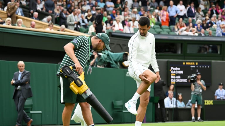 A blower was brought to Centre Court to dry a stubborn wet spot.