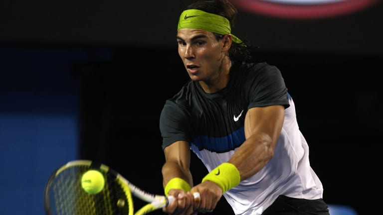 New year, new look: In 2009 Nadal surprised fans by ditching the sleeveless shirts for a cleaner silhouette on his way to victory at the 2009 Australian Open.