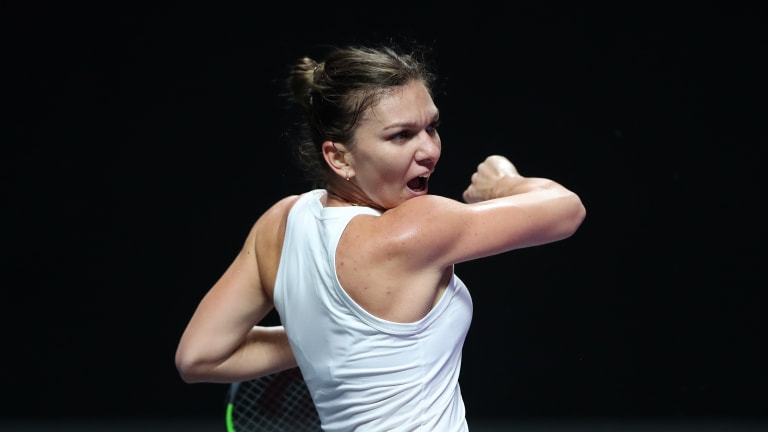 Down match point, Halep wins tense WTA Finals tussle over Andreescu