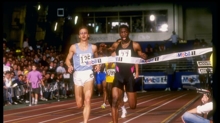 Olympic track and field star Michael Johnson (right) crossing the finish line.