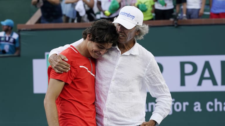 With an injured ankle, Fritz didn't appear to stand a chance against Nadal. But the roles soon became reversed, and it was the American—here with his father—who gave the winner's speech.