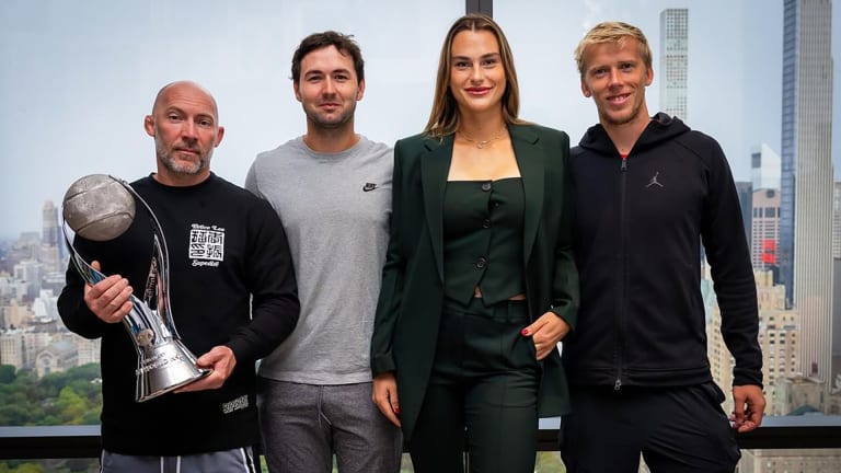 Sabalenka with her team, led by Anton Dubrov (center left), after rising to the WTA world No. 1 ranking for the first time.