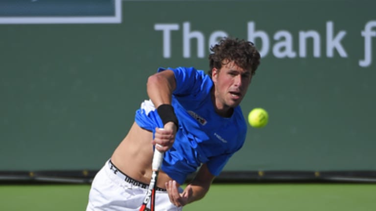 Robin Haase, of the Netherlands, serves to Stanislas Wawrinka, of Switzerland, during their match at the BNP Paribas Open tennis tournament, Sunday, March 15, 2015, in Indian Wells, Calif. (AP Photo/Mark J. Terrill)
