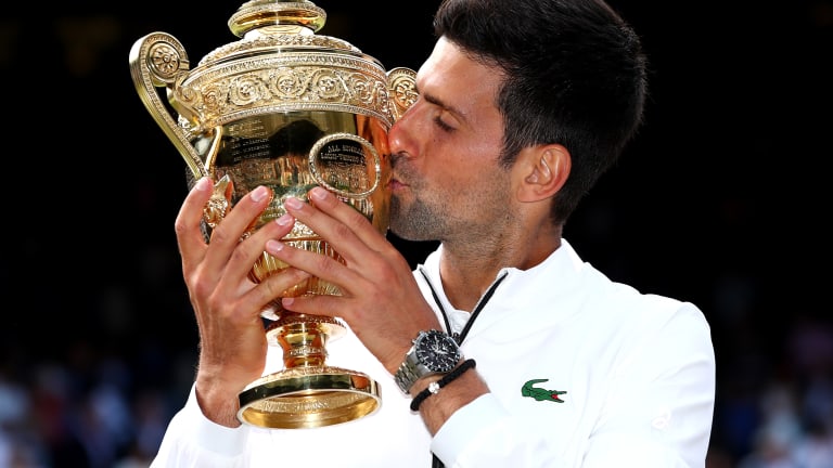 Djokovic saves two match points to top Federer for 16th major title