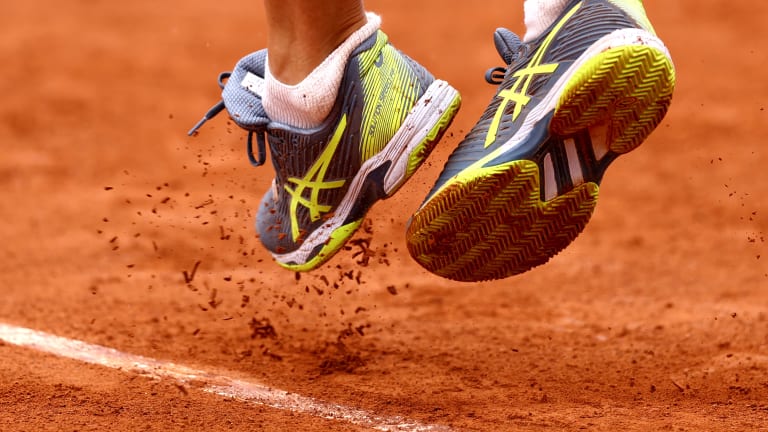 Dan Evans' shoes on Monday, behind the service line.