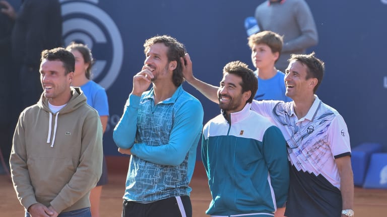 Robredo reacts to Feliciano Lopez's video tribute as Roberto Bautista Agut and Marc Lopez look on.