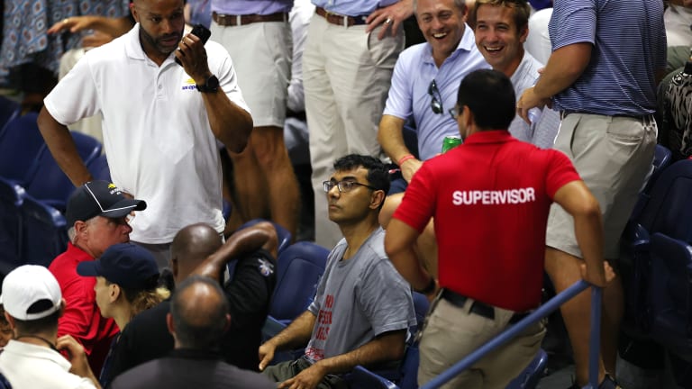 Players left the court after it was determined this man wasn't going anywhere anytime soon.
