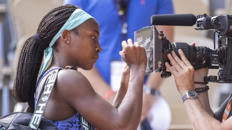 “Hopefully it gets into the heads of people in office to hopefully change things,” Gauff said of her pointed words—"Peace. End gun violence—following her semifinal victory at Roland Garros.