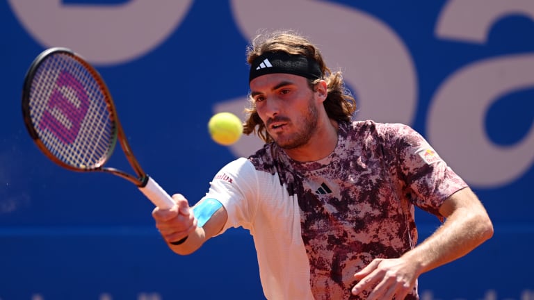 Stefanos Tsitsipas of Greece plays a forehand against Denis Shapovalov of Canada during the third round match on day four of the Barcelona Open Banc Sabadell 2023