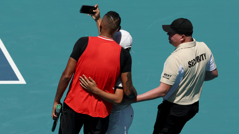 Amidst the madness, a fan made it on court during the match to ask Kyrgios for a selfie; the Aussie obliged.