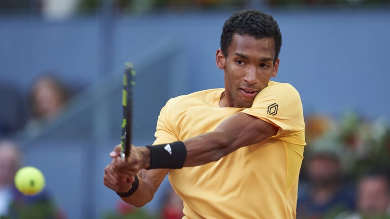 Auger-Aliassime benefitted from two retirements and a walkover in Madrid, but also upset Casper Ruud.