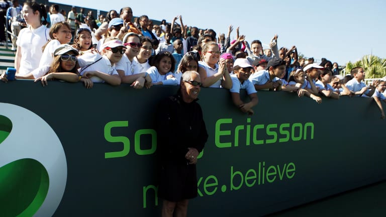 Nick Bollettieri poses with a group of children at Kids Day at during the 2010 Sony Ericsson Open.