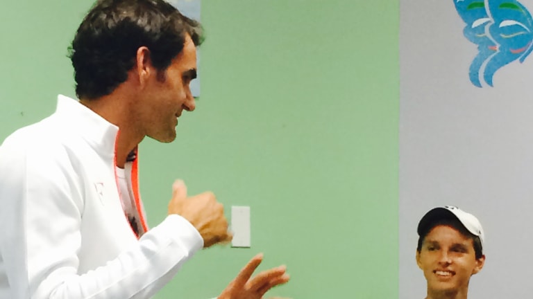 Cancer survivor meets Roger Federer, who helped him through recovery