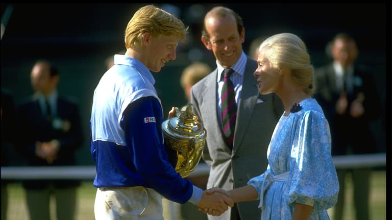 Becker receives the Wimbledon winner's trophy after his four-set victory over Kevin Curren.