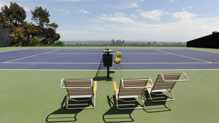 Pull up a chair to enjoy the tennis—and the view.