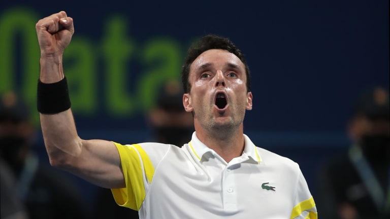 Top 5 Photos 3/8: 
Bautista Agut fights
 past gritty Opelka