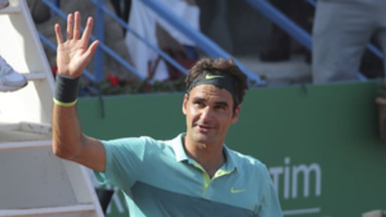 Roger Federer of Switzerland waves to fans during the quarterfinal match against Daniel Gimeno-Traver of Spain at the Istanbul Open tennis tournament at Garanti Koza Arena in Istanbul, Turkey, Friday May 1, 2015. Federer won the match. The first ATP World Tour event in Turkey is being played on clay from April 27, to May 3, 2015. (AP Photo)