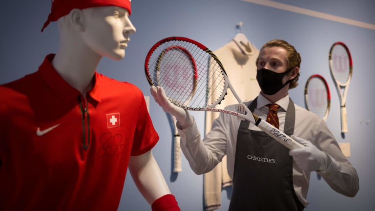 Some of the Swiss' title-winning apparel was auctioned at Christie's London, to benefit the Roger Federer's Foundation. (Photos from June 21, via Getty Images.)