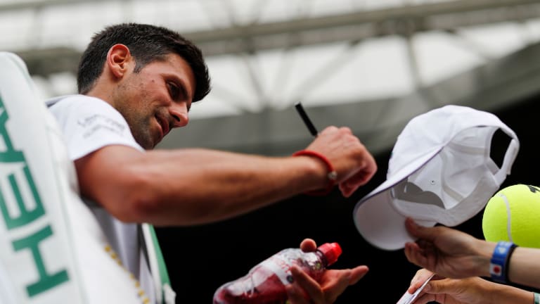 Defending champ Djokovic brushes aside Goffin; back in Wimbledon semis