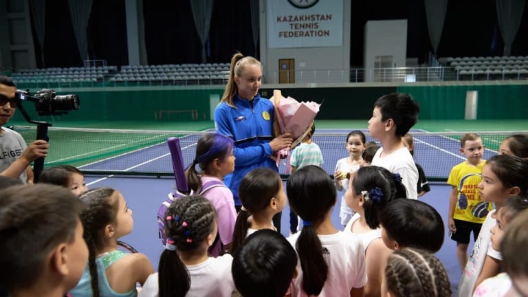 The 23-year-old met with juniors from in four of Kazakhstan's major cities during her Wimbledon trophy tour.