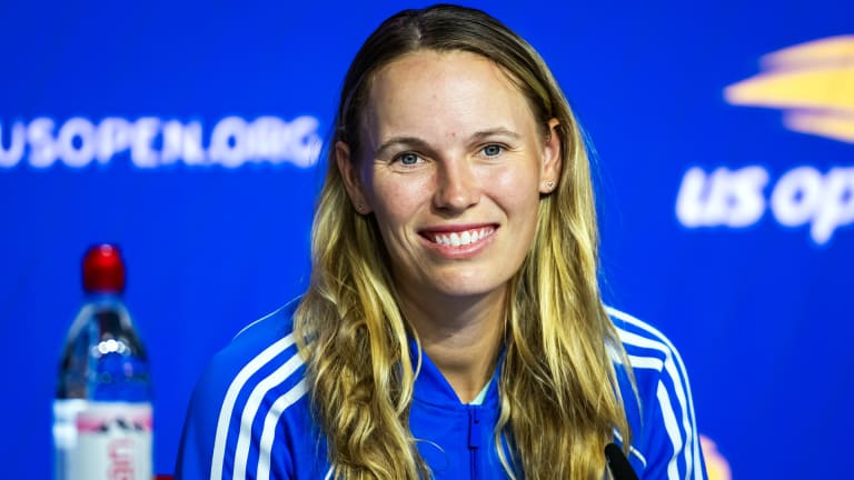 Wozniacki at a US Open press conference wearing a "Billie Blue" Adidas jacket.