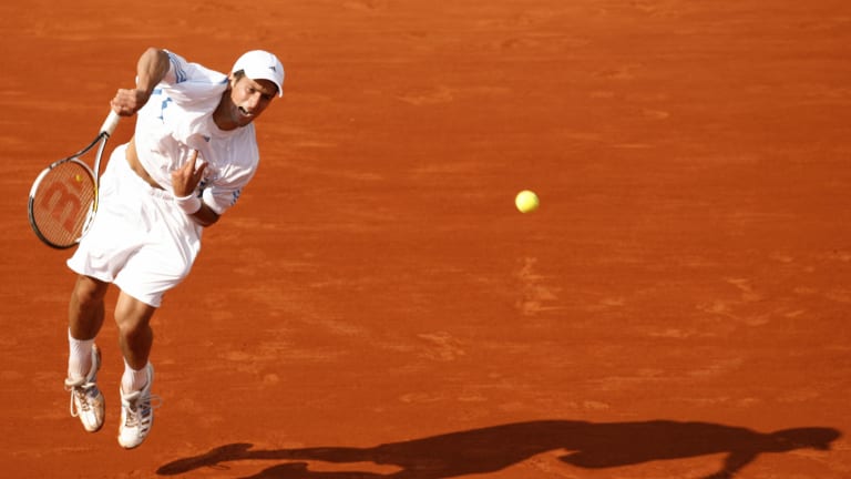 Novak Djokovic executes a powerful serves to Gael Monfils on the fourth round of the 2006 French Open.