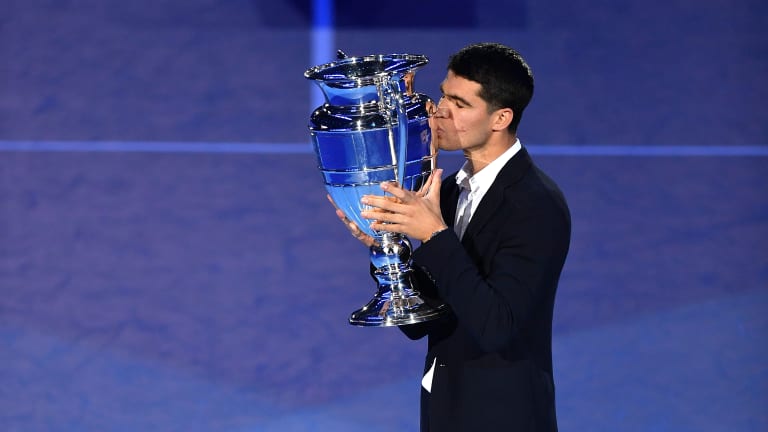 Alcaraz takes in the historic moment and kisses the trophy he received for number 1 ATP ranking during the ATP Finals on November 16, 2022.