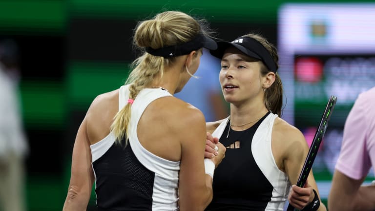 Twinning! Wozniacki and Volynets shake hands at the net.