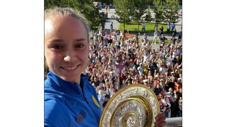 The Wimbledon champion presented the Venus Rosewater Dish to enthusiastic fans outside of the country's National Tennis Center.