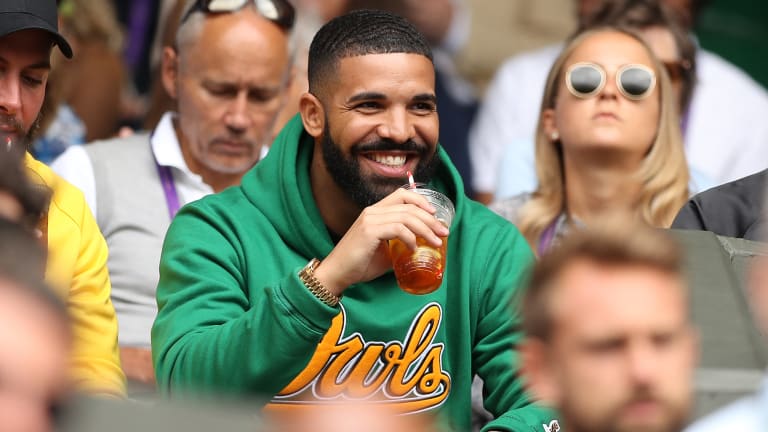 Here is Drake in 2018, taking in Serena's match against Camila Giorgi at Wimbledon's Centre Court—a year after Serena and Ohanian had wed.