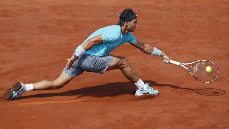 The 'Raging Bull' logo on his right shoulder, and seven-inch inseam shorts: Nadal's new signature look in 2014