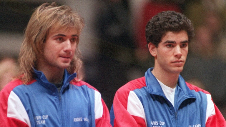 Sampras stands alongside Agassi after a disappointing loss in Lyon.