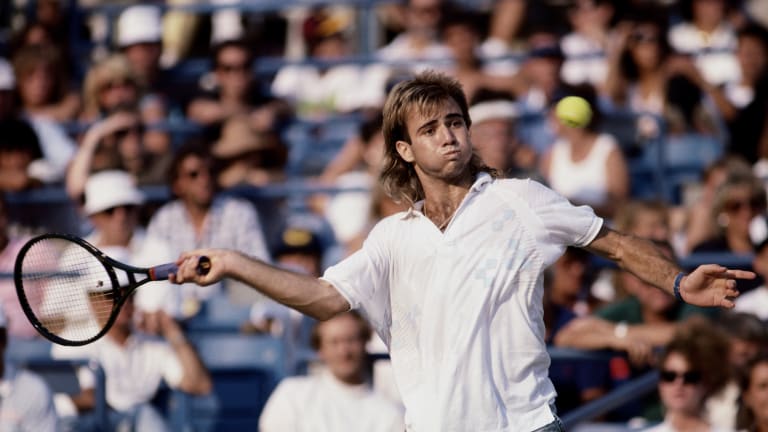 Sporting his denim-style shorts, Andre Agassi prepared to return a serve at the U.S. Open Tennis Championship in 1988.